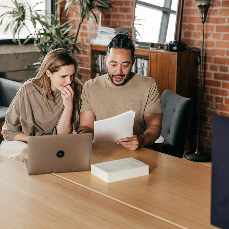 Couple ReviewingPaperwork 792x792